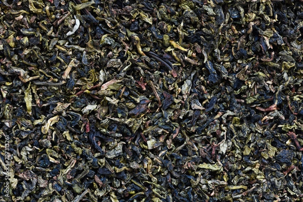 Fototapeta The background of dry leaves of yellow tea.