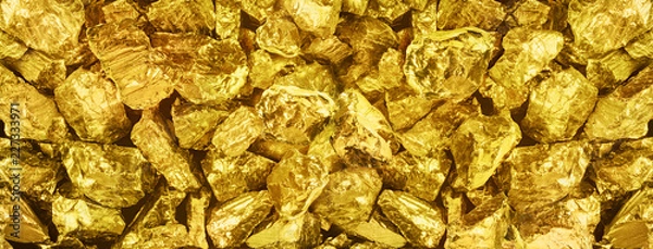 Obraz |Big panorama photo of many golden nuggets close-up. Wide background of shiny golden bars. Golden ingot  close-up on wide background.