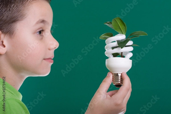 Obraz Kid with energy saving bulb