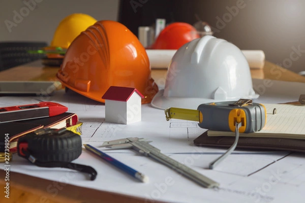 Fototapeta Engineer and Architect concept, Engineer Architects and real estate agent office team working with blueprints