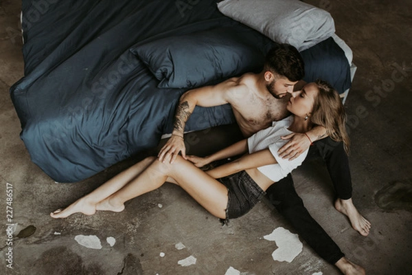 Obraz Beautiful loving couple kissing in bed