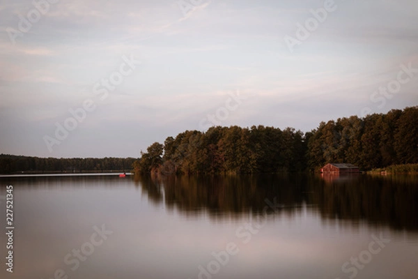 Fototapeta fishinghut on a lake in brandenbury