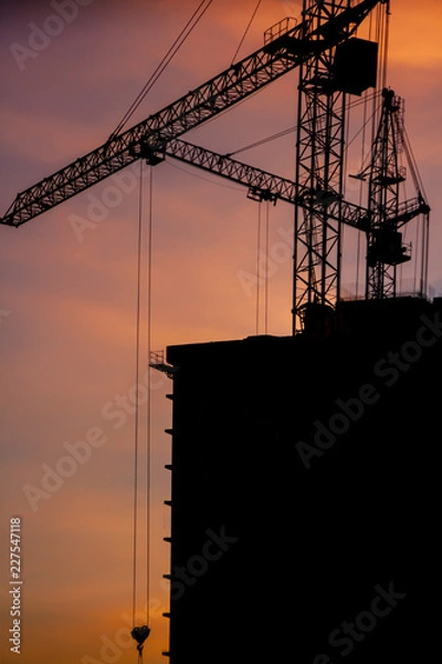 Obraz construction crane at sunset close-up
