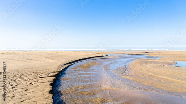 Fototapeta Cornwall Bude Beach with a stream running through