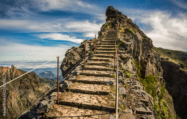 Obraz Madeira, Portugal. Steps on a hiking path between Pico do Arieiro and Pico do Ruivo above the clouds.