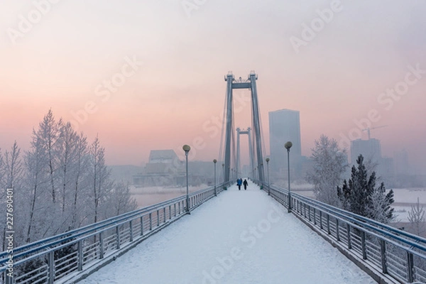 Obraz Cable-stayed bridge across the Yenisei river in the winter morning. Krasnoyarsk, Krasnoyarsk Krai, Russia.