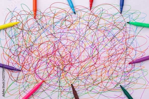 Fototapeta different colors felt tip pens and scribble on white paper, abstract, creative concept, children drawing