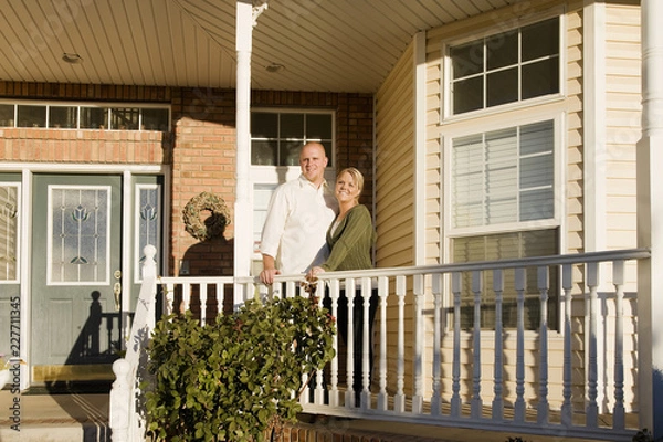 Obraz couple in front of new house