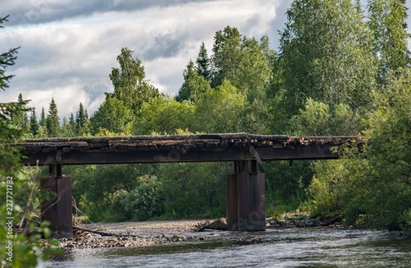 Obraz Dilapidated bridge across the river Uls