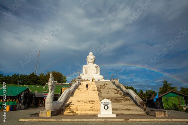 Fototapeta amazing rainbow cover Phuket big Buddha..Phuket Big Buddha is one of the island most important and revered landmarks on the island..time lapse rainbow above Phuket big Buddha