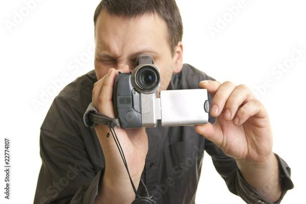 Obraz man shoots with a camera