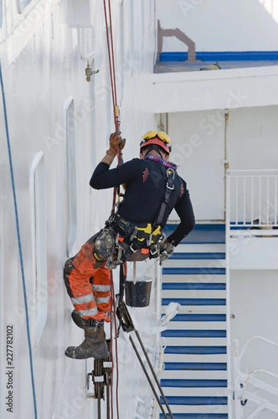 Obraz construction worker on ladder