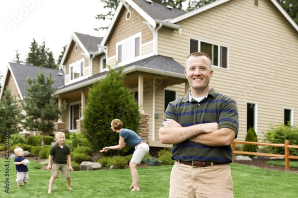 Obraz happy couple with their house in front of new house