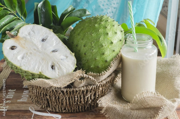 Obraz Soursop (also graviola, guyabano, and in Latin America, guanábana) is the fruit of Annona muricata, a broadleaf, flowering, evergreen tree