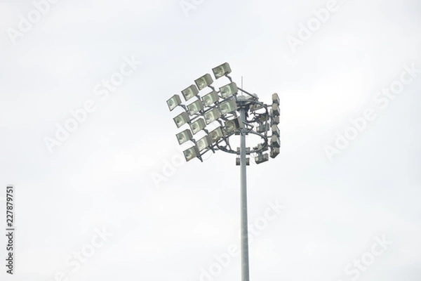 Obraz Stadium lights inside a stadium on a overcast day background