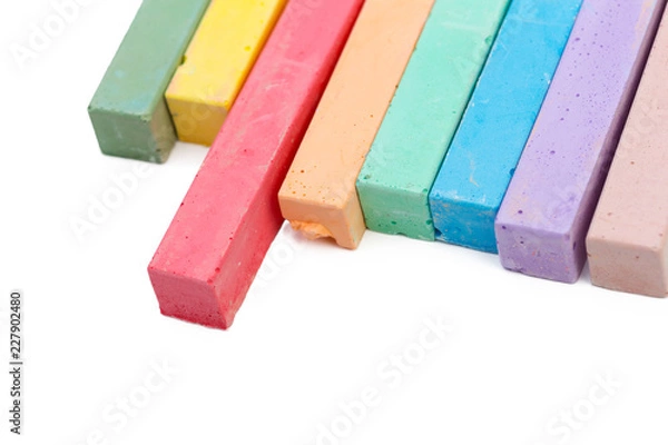 Fototapeta Colored chalks over a white background close up