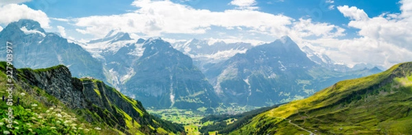 Fototapeta Beautiful panoramic alpine scenery in Swiss Alps near Grindelwald