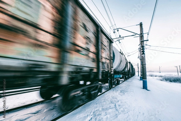 Obraz Winter railway and train with cargo.