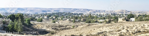 Fototapeta panorama of a neighborhood in Arad Israel on a clear fall day with desert mountains and bedouin villages in the background