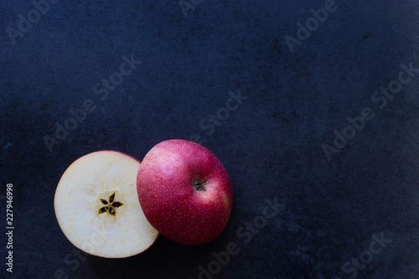 Obraz Slice apple on black background,