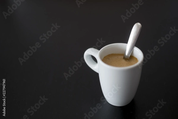 Obraz cup of coffee on a black table