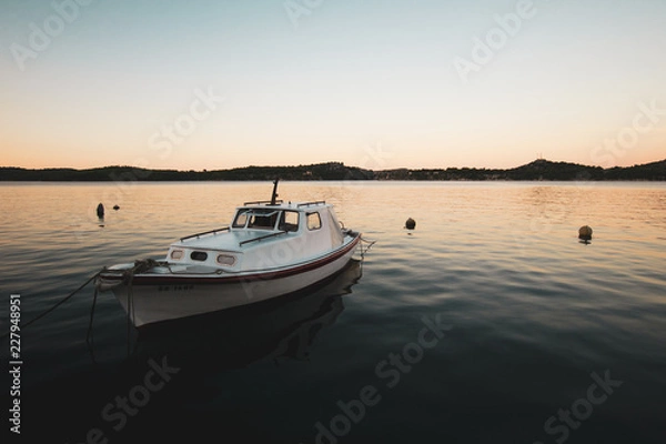 Fototapeta Sunrise at the marina in Sibenik, Croatia ( wschód słońca w porcie w Szybeniku w Chorwacji)