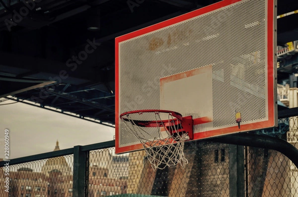 Fototapeta Old basketball net urban style, under a bridge in NY