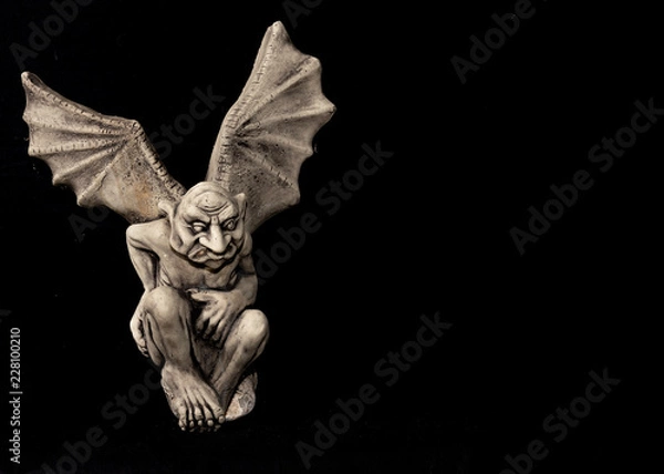 Obraz gargoyle with wings on black background