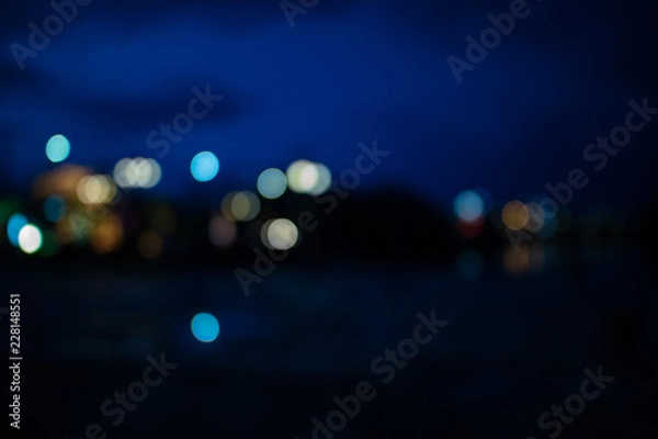 Fototapeta Lights in the city with lights blurred background for graphic design.