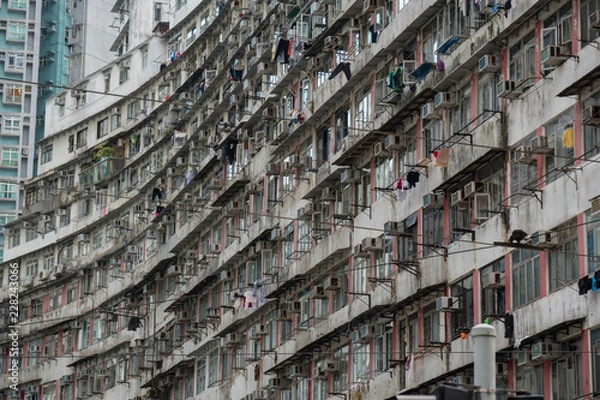 Obraz Old skyscraper during the day, endless windows, noir, moody dystopian old grey building