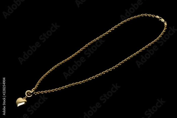 Fototapeta Golden necklace on a black background