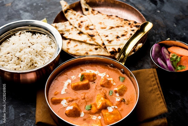 Obraz Paneer Butter Masala or Cheese Cottage Curry in serving a bowl or pan, served with or without roti and rice