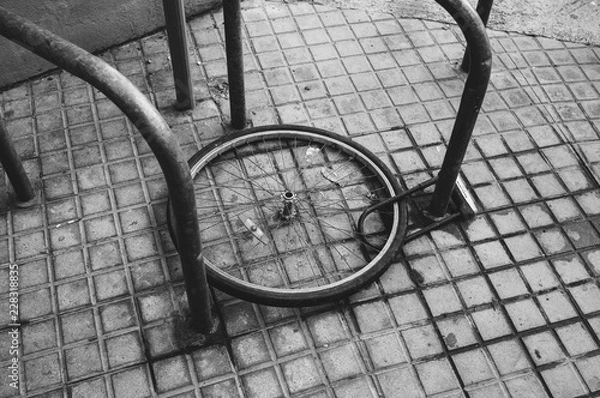 Obraz Bicycle wheel with locker on the street