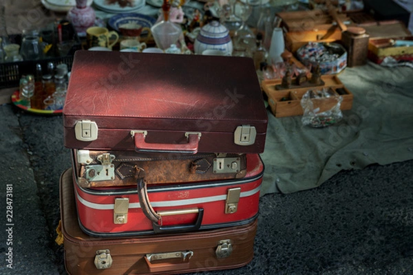 Obraz Old and nostalgic suitcases in historical flea market of Lisbon,Portugal.