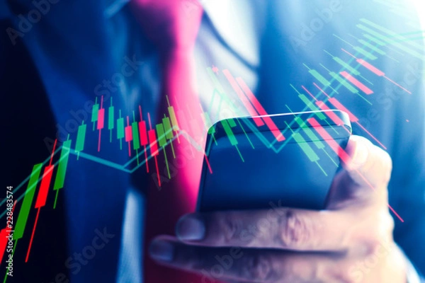Obraz A Businessman making trading with smartphone.Online trading concept.