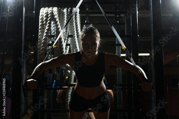 Obraz Young girl TRX trainer