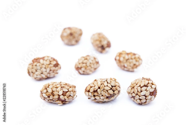 Fototapeta Coated peanuts with sesame isolated on white background