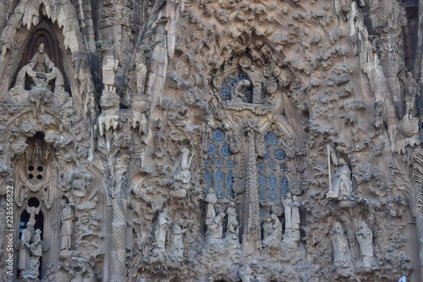 Fototapeta Gothic temple with high towers and different facades.