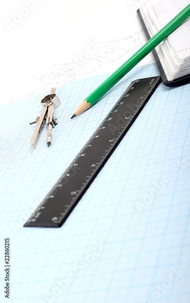 Fototapeta Compass on Graph Paper with notebook