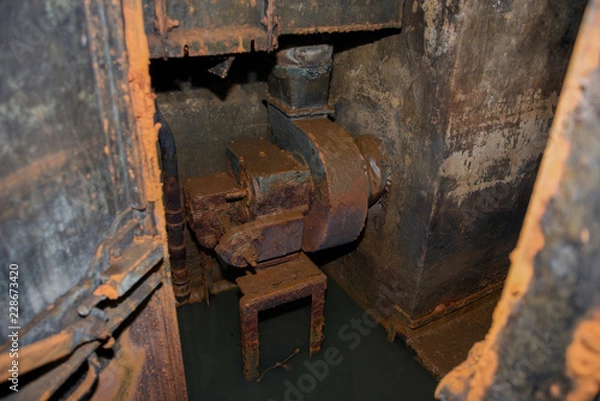 Fototapeta An abandoned bunker, an old military pillbox, an infantry weapon preserved after the war