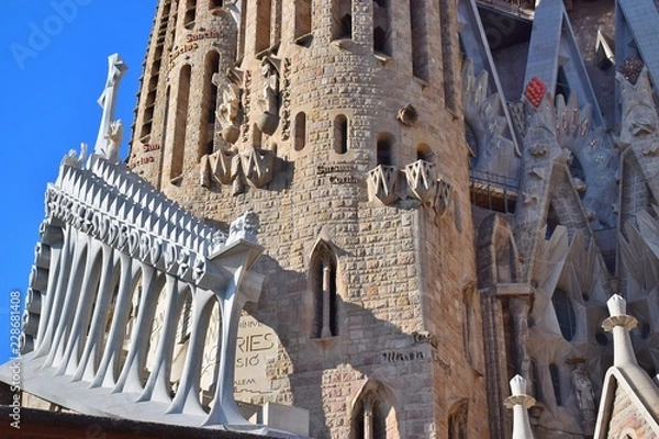 Fototapeta Gothic temple with high towers and different facades.