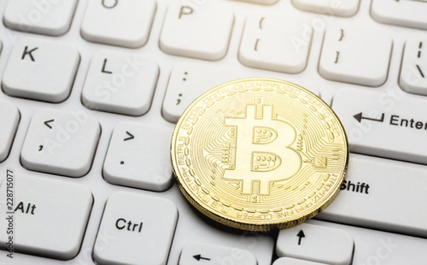 Fototapeta Bitcoin on computer keyboard