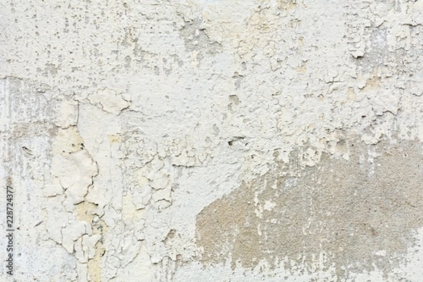 Fototapeta the white old paint texture is chipping and cracked at the wall