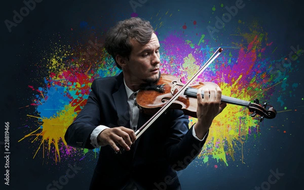 Fototapeta Young classical violinist musician with colorful splotch wallpaper
