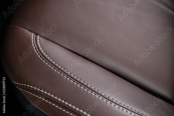 Fototapeta A part of a leather seat in car