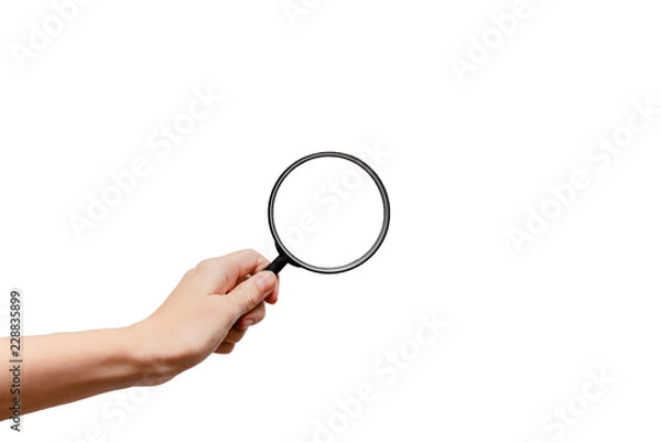 Obraz Femal hand holding magnidying glass. Detective and searchConcept. White background, isolated, close up