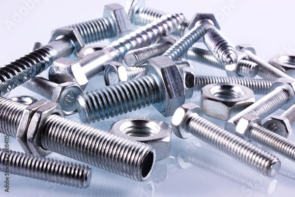 Fototapeta Schrauben und Muttern auf Glas