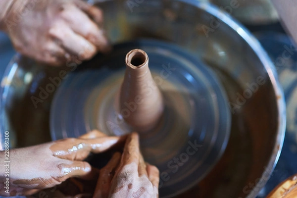 Obraz Master class on modeling of clay on a potter's wheel In the pottery workshop