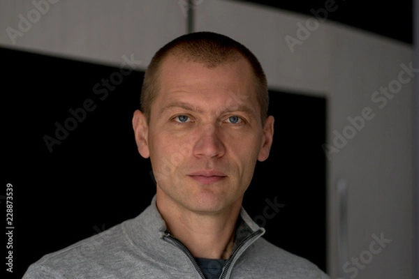 Fototapeta Close Up Portrait Of Man Standing on the room