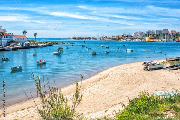 Obraz View on the Ferragudo and Portimao Algarve across the river and many fishing boats in the foreground
